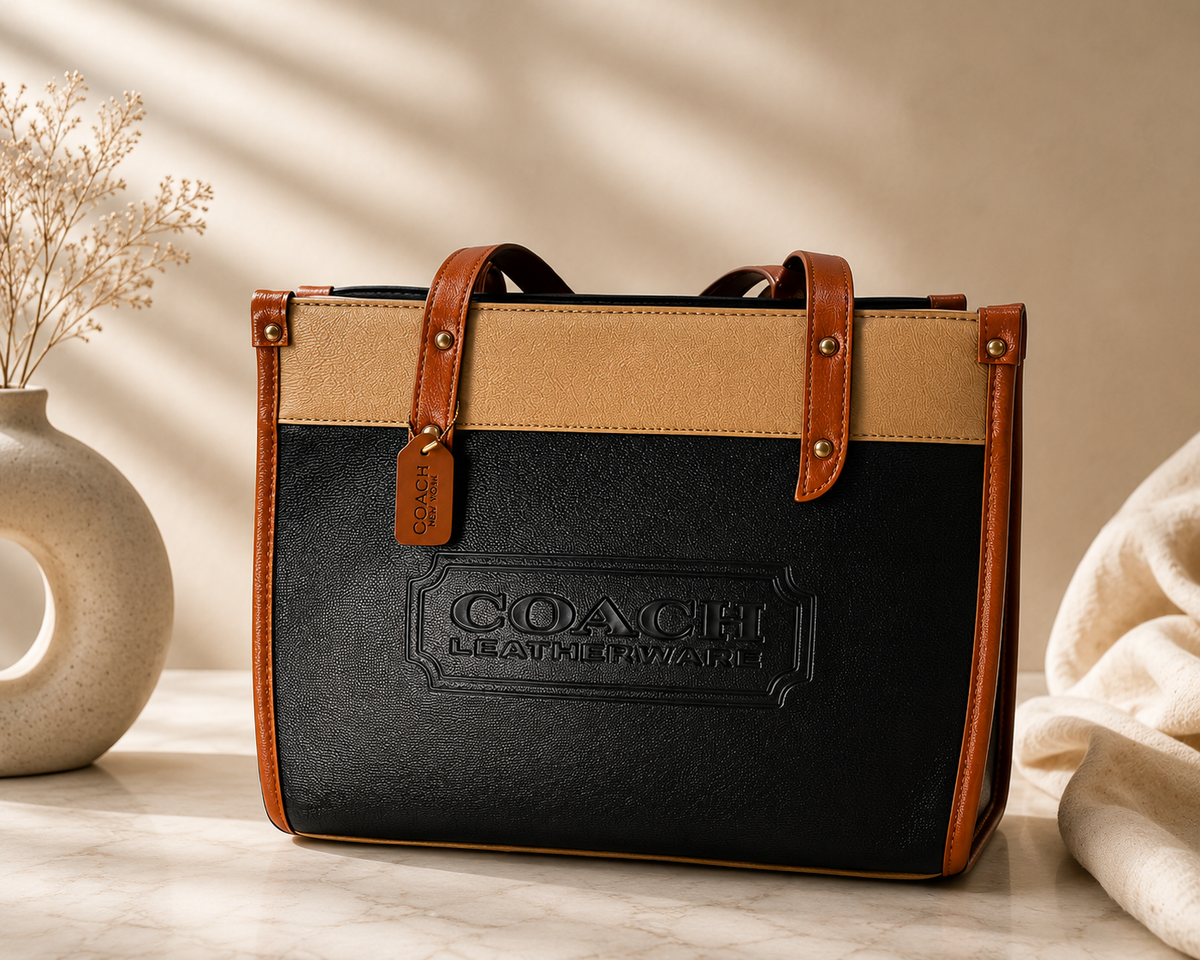 Black Coach Tabby Shoulder Bag 26 features a distinct brass "C" logo hardware