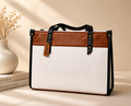 White Coach Tabby Shoulder Bag 26 features a distinct brass "C" logo hardware