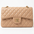 Chanel Mini Flap Bag in Apricot lambskin leather with a gold-tone chain strap and CC turn-lock