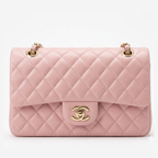 Chanel Mini Flap Bag in Pink lambskin leather with a gold-tone chain strap and CC turn-lock