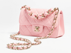 Chanel Mini Flap Bag in Pink lambskin leather with a gold-tone chain strap and CC turn-lock