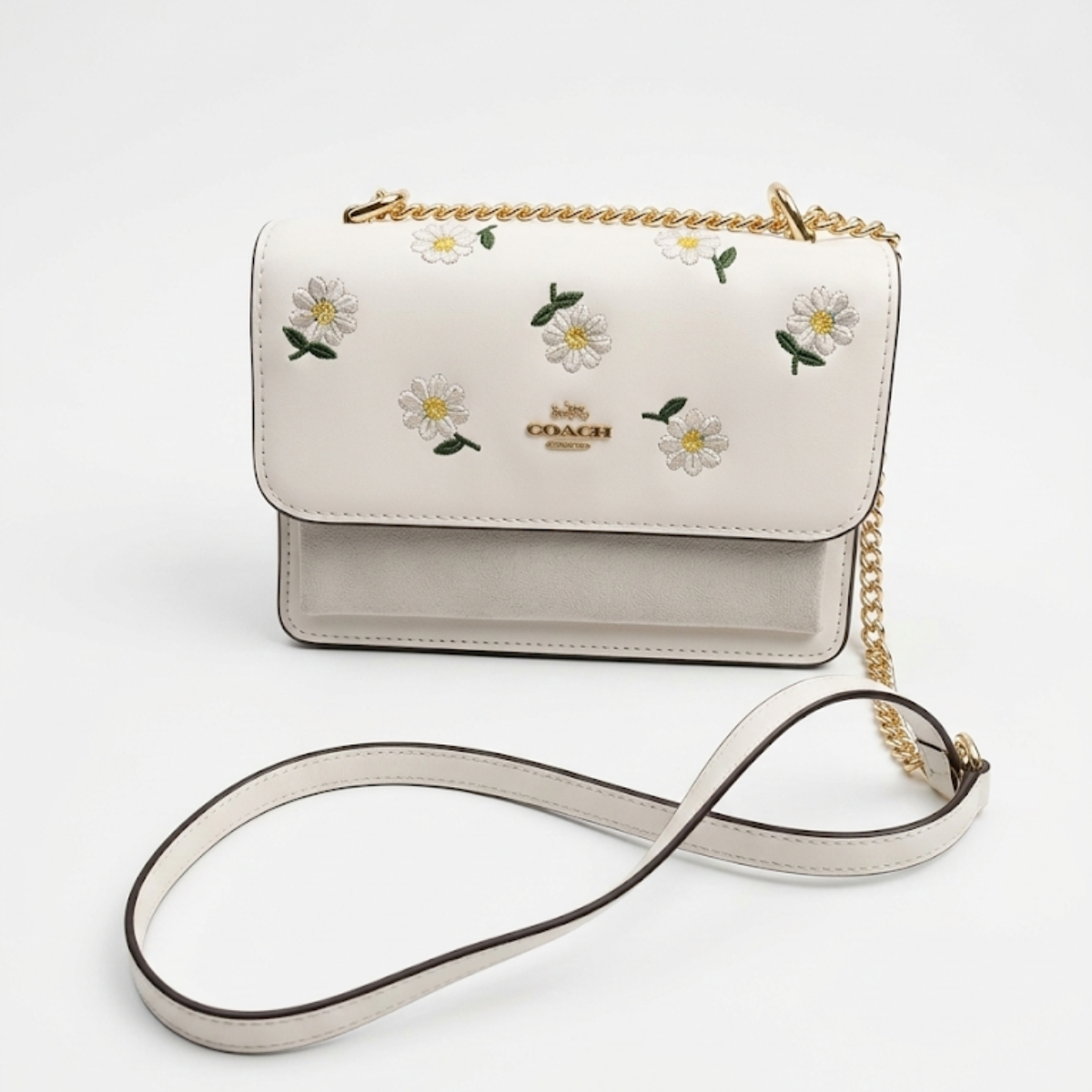 Coach Klare crossbody bag with daisy embroidery in white smooth leather with a gold-tone chain strap