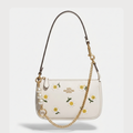 Coach Nolita 19 with Daisy Embroidery in refined pebble leather and white color.