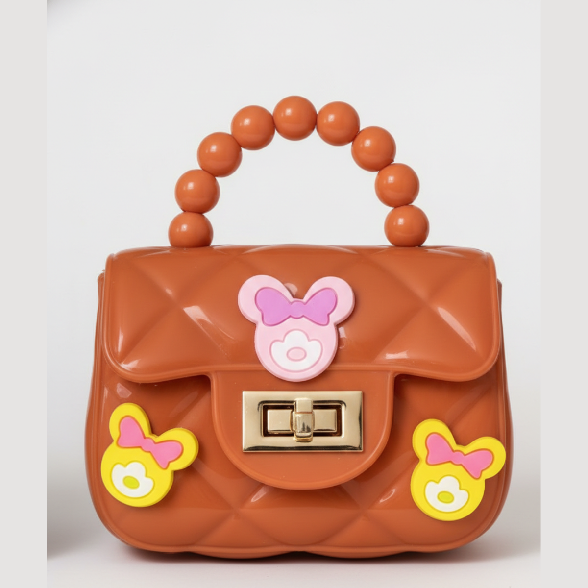 Mini Sling Bag with charms in Orangish Pink