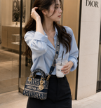 Dior Lady D-Lite bag in the mini size with blue Dior Oblique jacquard embroidery