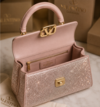 Valentino Garavani Mini VSling handbag entirely covered in rhinestones