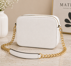 Guess Noelle Crossbody Camera Bag in white textured polyurethane material.