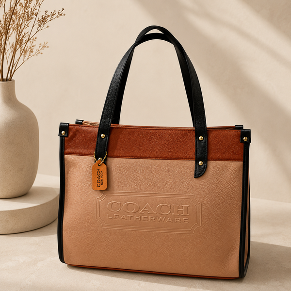 Sandstone Beige & Cognac Coach Tabby Shoulder Bag 26 features a distinct brass "C" logo hardware