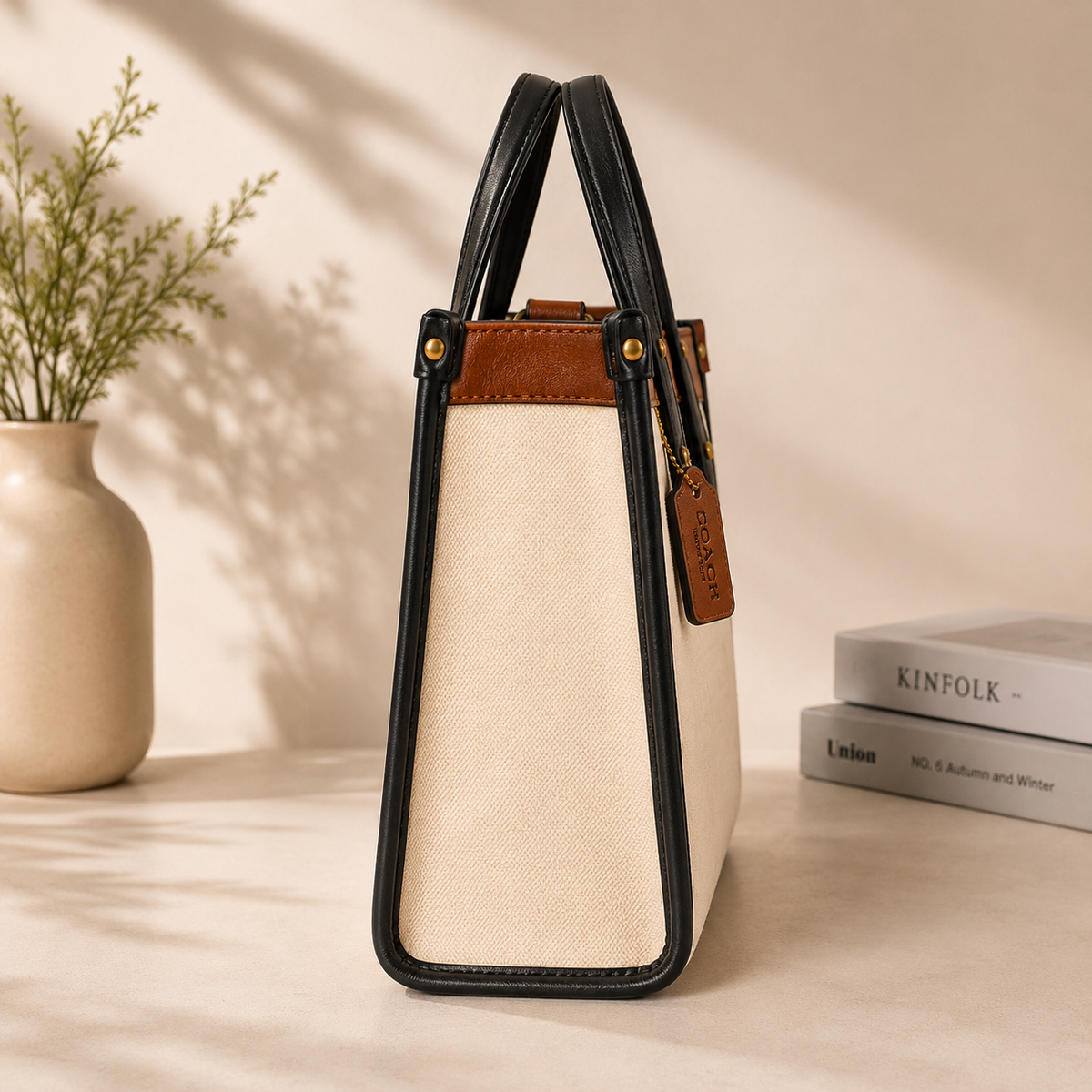 Beige Coach Tabby Shoulder Bag 26 features a distinct brass "C" logo hardware