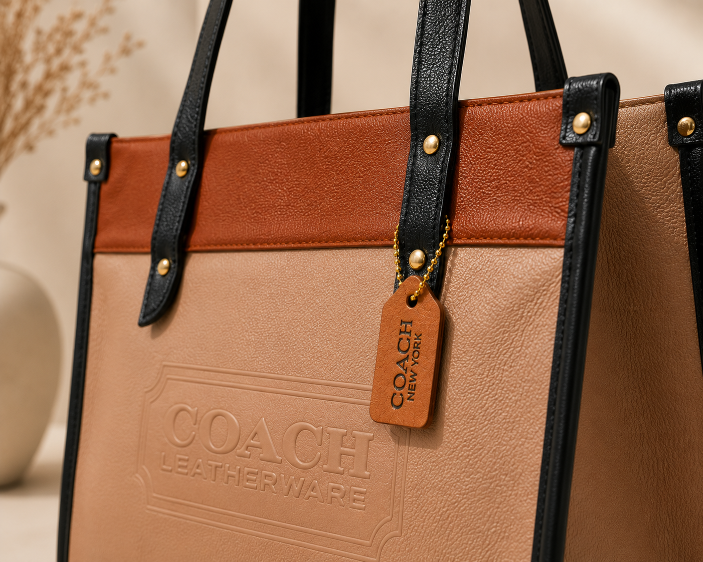 Sandstone Beige & Cognac Coach Tabby Shoulder Bag 26 features a distinct brass "C" logo hardware